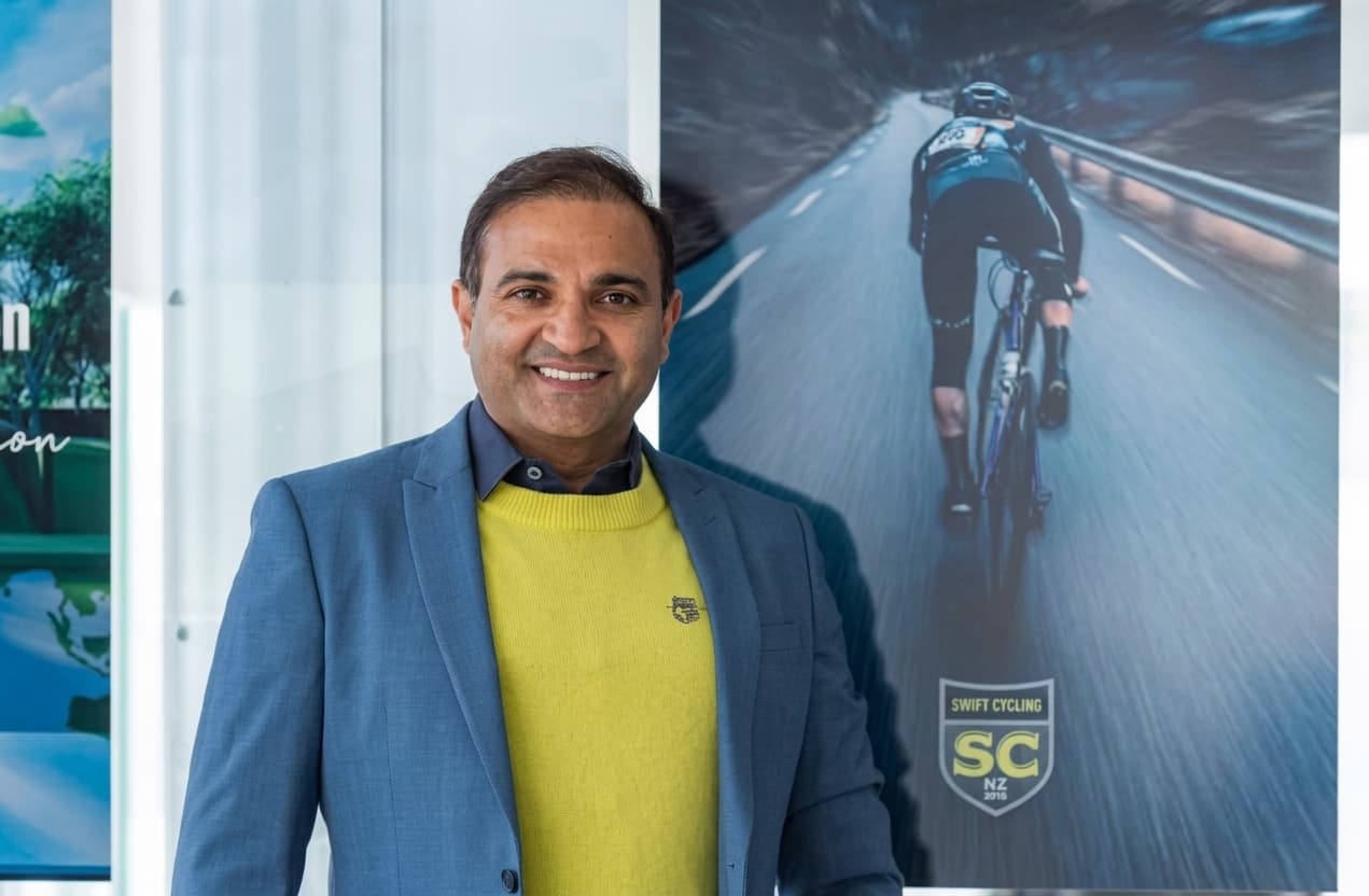 Ritesh Mani, founder of the Safer Cycling Foundation, beside Safer Cycling Foundation imagery